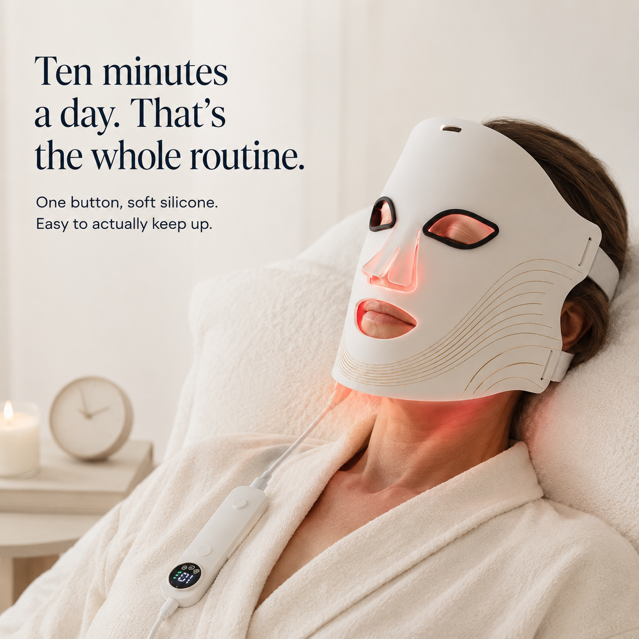 Woman relaxing in a robe wearing the DermaPro LED face mask